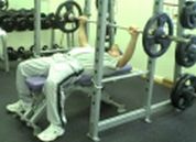 man doing barbell chest press